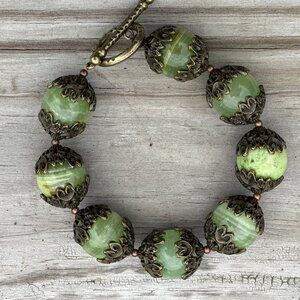 Chunky green jade gemstone bracelet with bronze accents